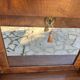 A small piece of Bonheur du jour with detached columns in Empire-era mahogany.
