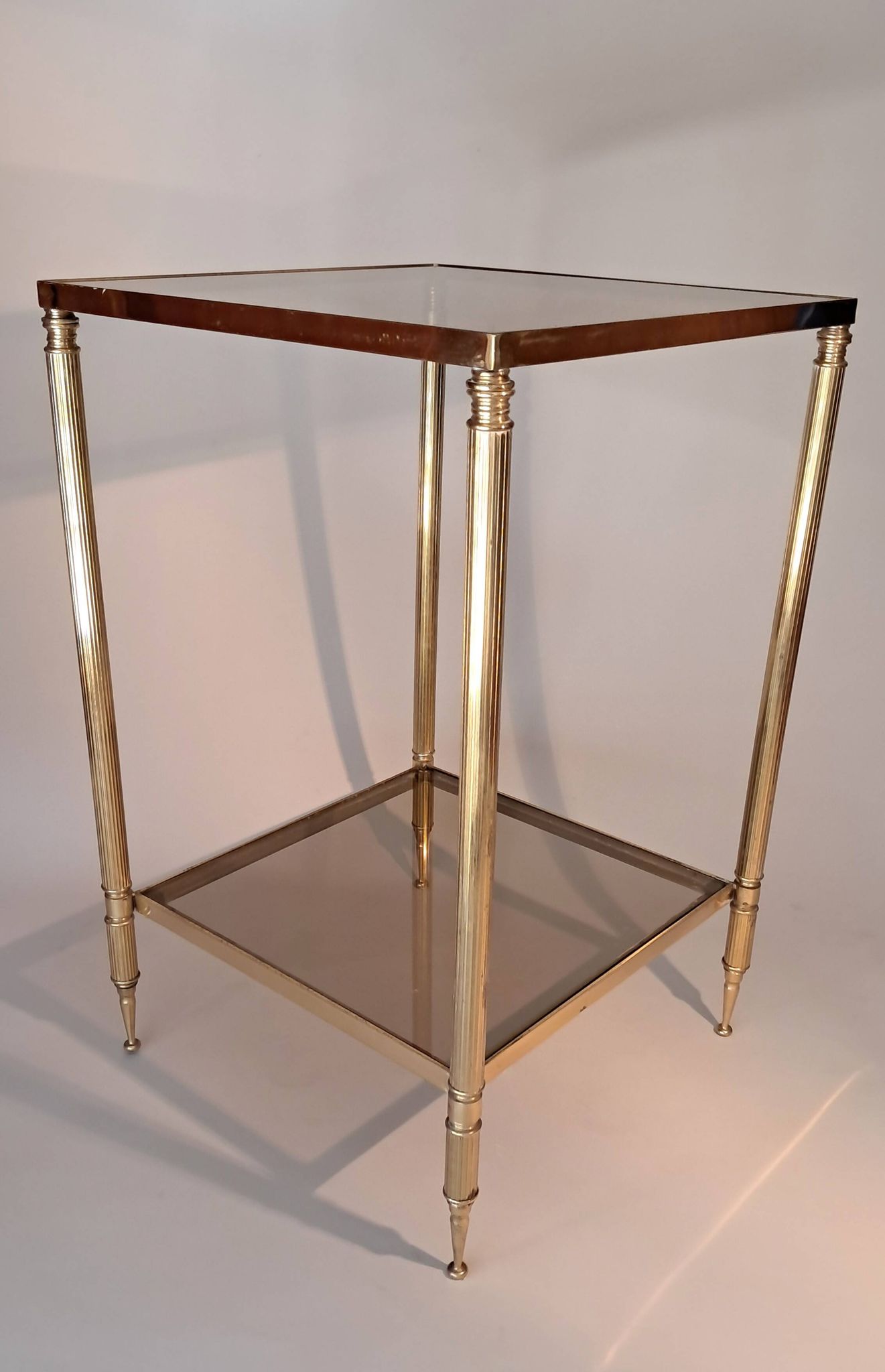 Gilded brass and smoked glass end table, 1960s.