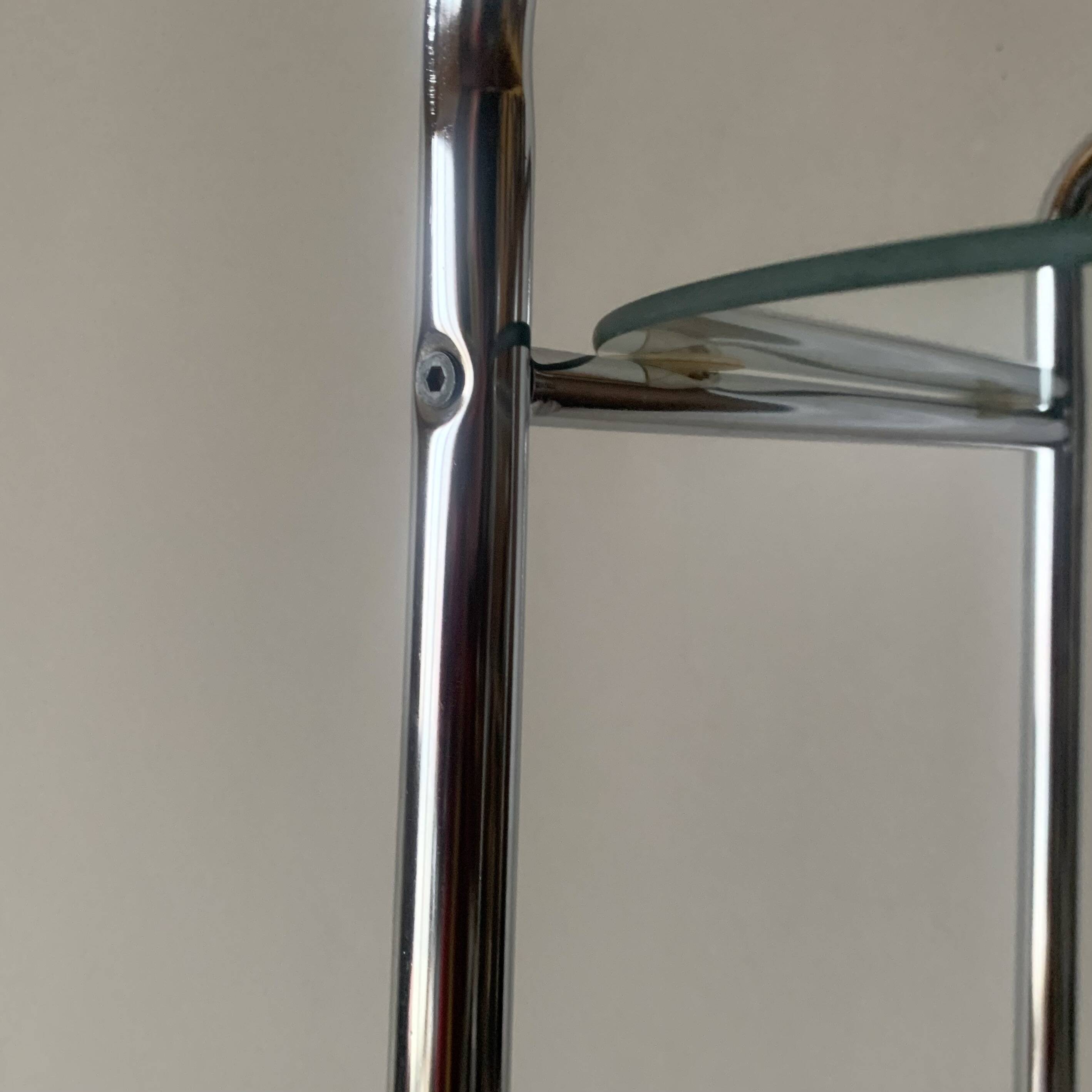 Pedestal table, vintage chrome steel saddle with 2 round windows