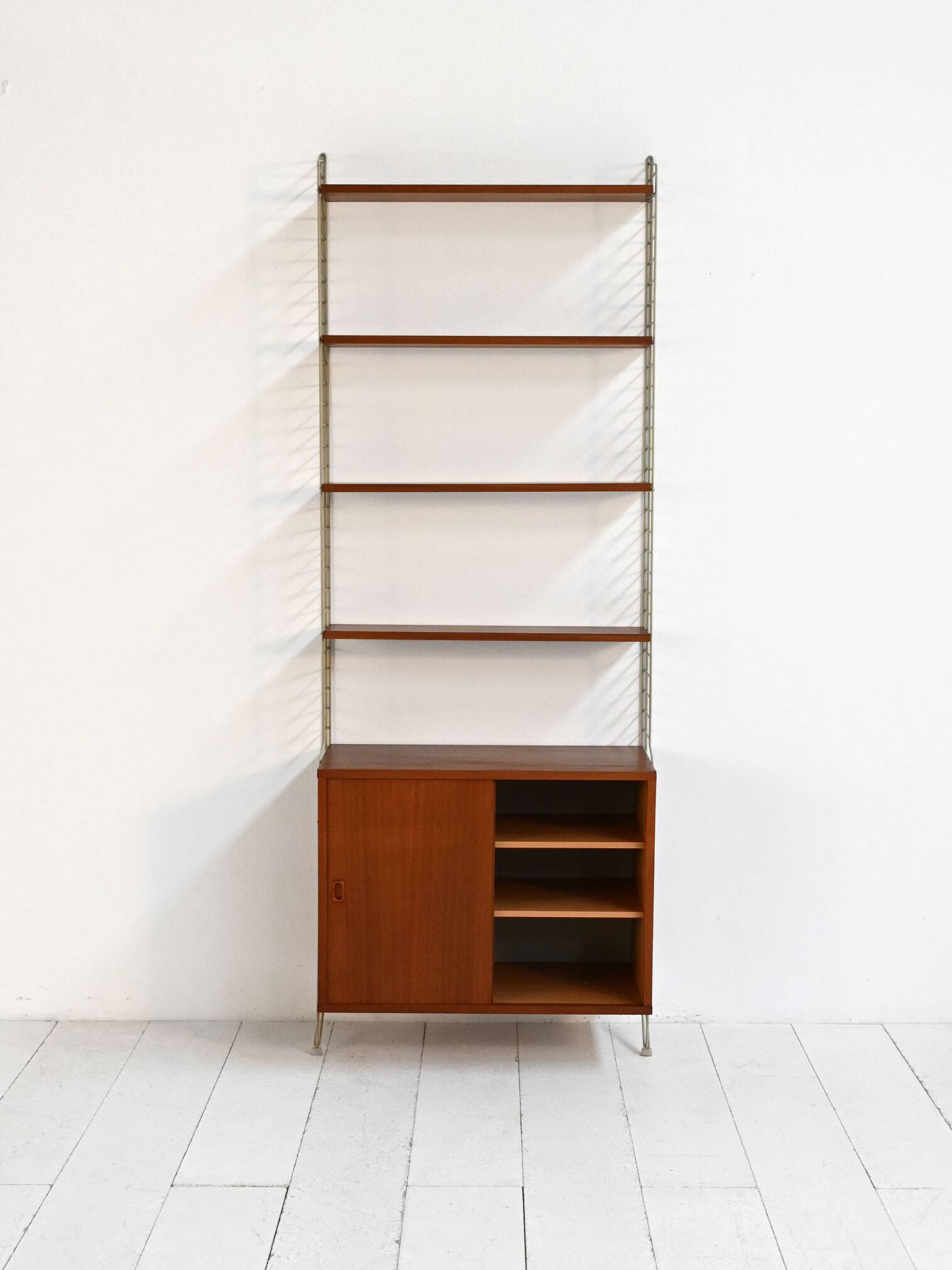 “String” wall-mounted shelving unit, Nisse Strinning BFB-hyllan, 1950s–60s