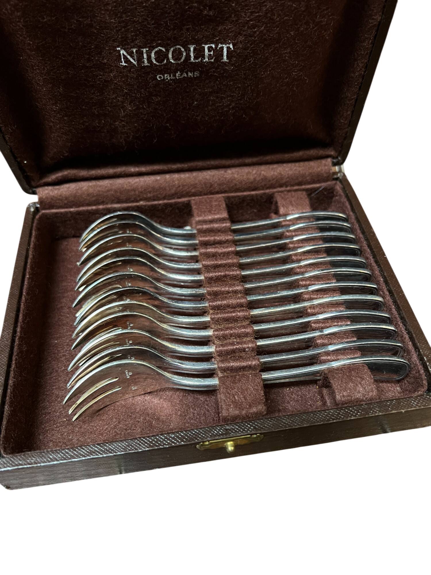 Set of 12 silver-plated metal dessert forks from the Nicolet Orléans brand
