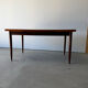 Rectangular extendable dining table with Scandinavian design in teak.