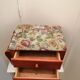 Wooden and fabric footrest with 2 drawers and book rack