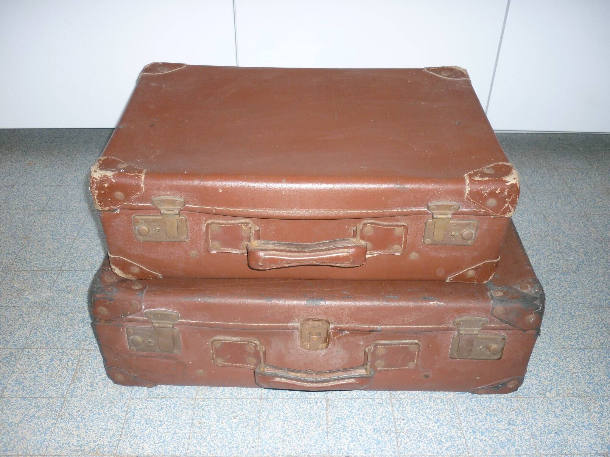 Pair of red suitcases from the 1950s