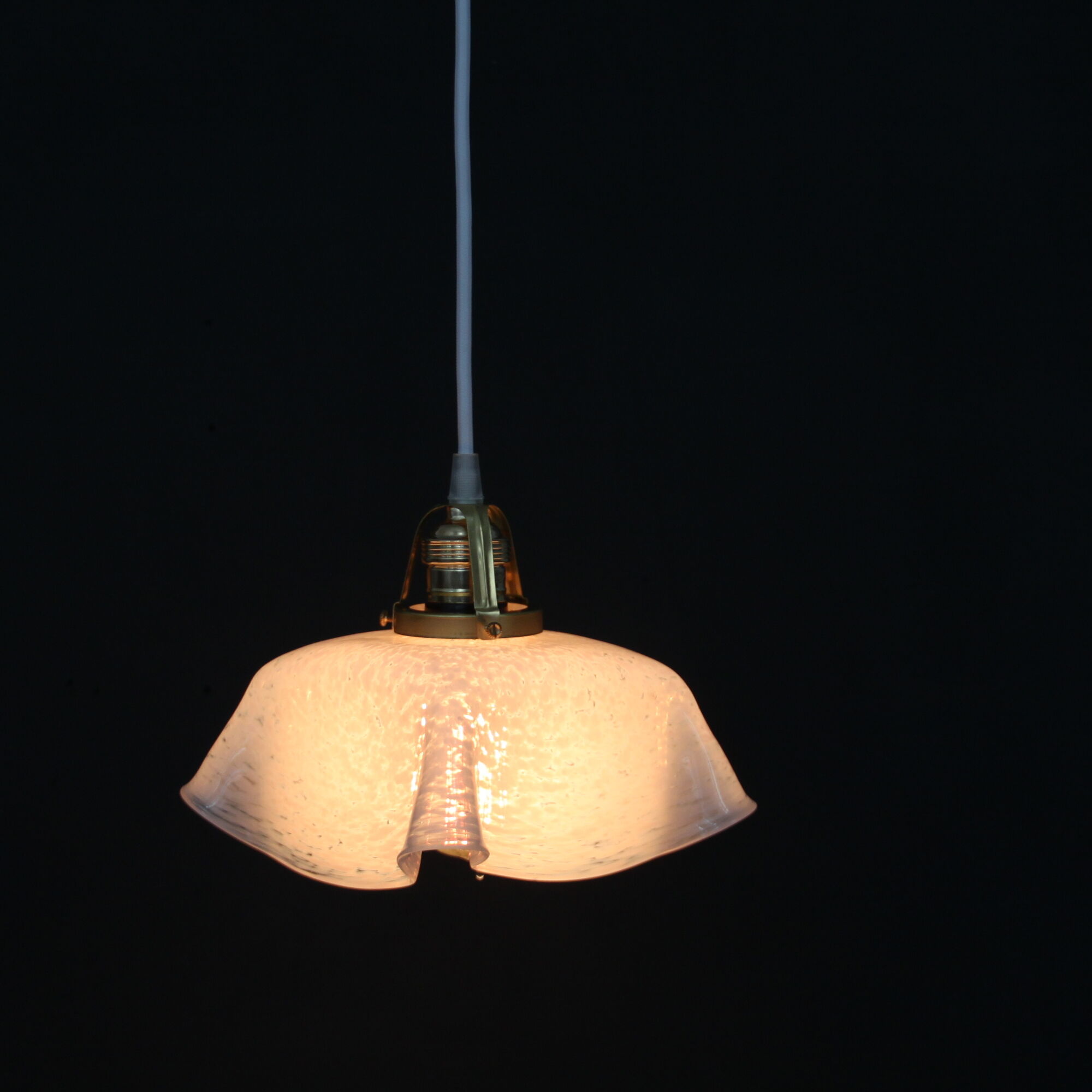 Hanging lamp draped in glass