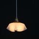 Hanging lamp draped in glass