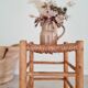 Old stool in wood and straw brutalist look