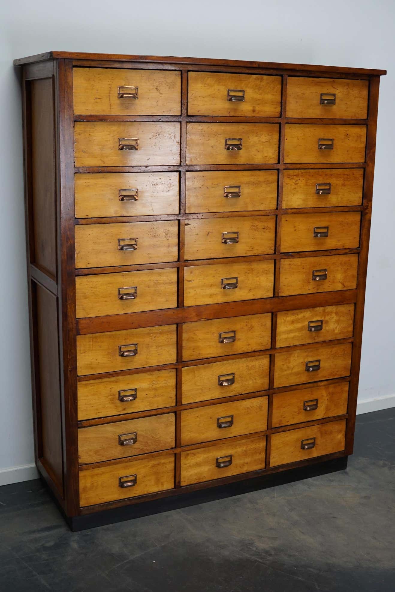 School cabinet bank of vintage Dutch drawers in mid-twentieth century pine