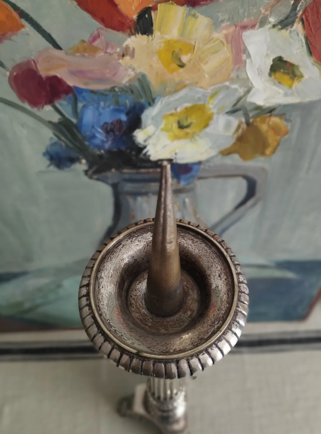 Old church candlestick in silver-plated metal