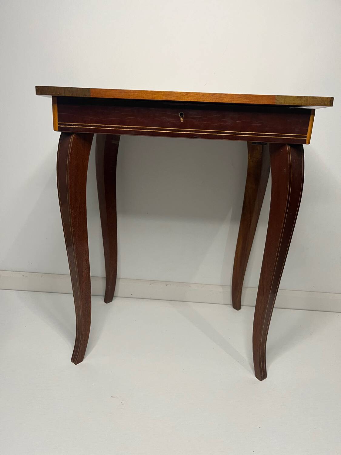 Small antique Italian inlaid table with Swiss music box.