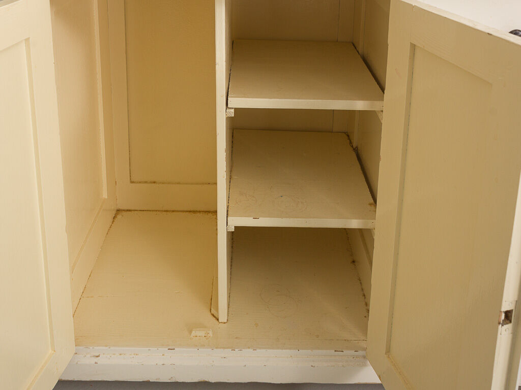 Small accent cabinet with drawers and swing doors