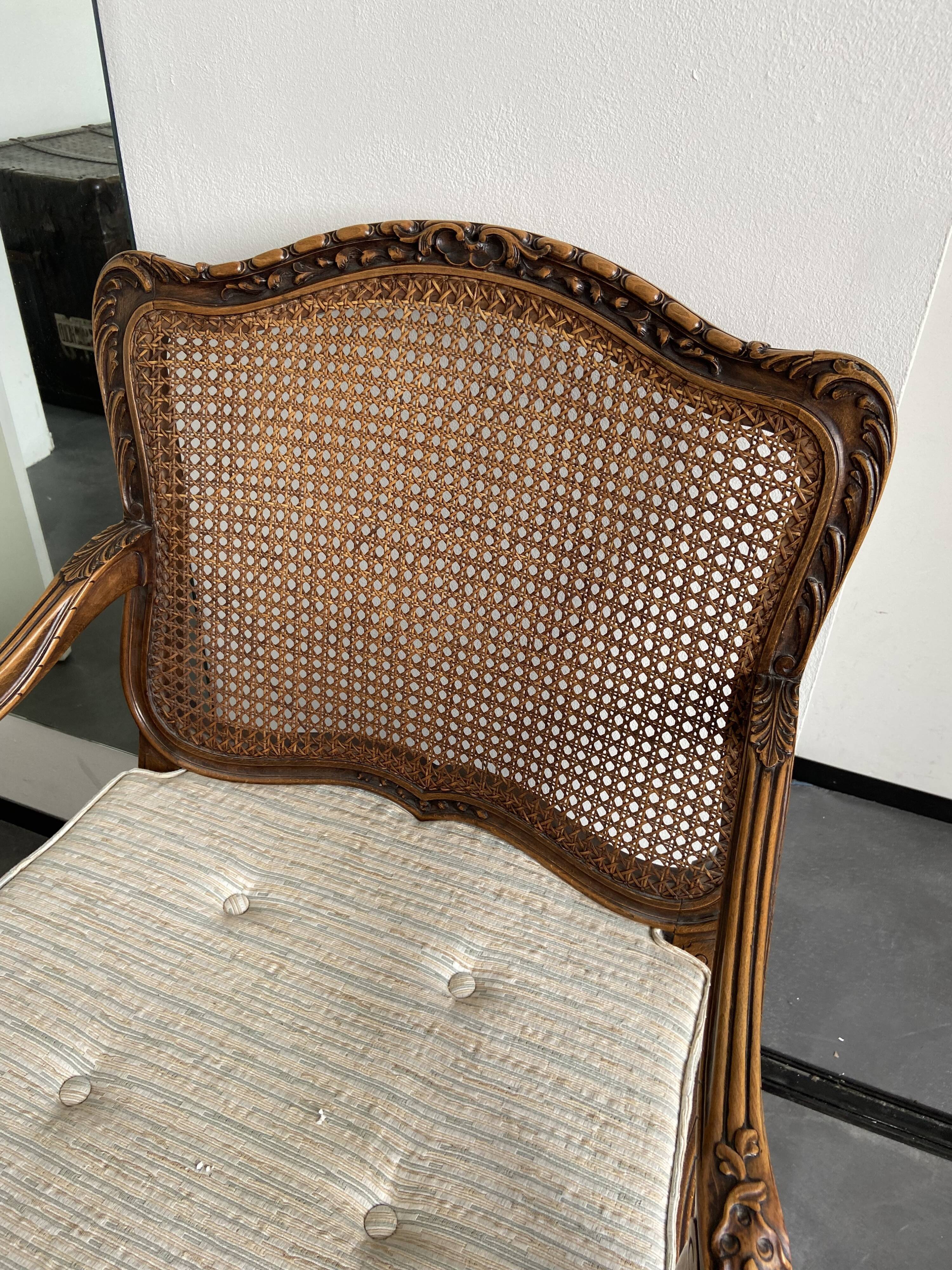 Regency canned armchair in carved walnut