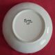 Round flat hollow Breton motifs signed HR Quimper