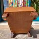 Low armchair, brown imitation leather