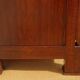 Crossed walnut chest of drawers