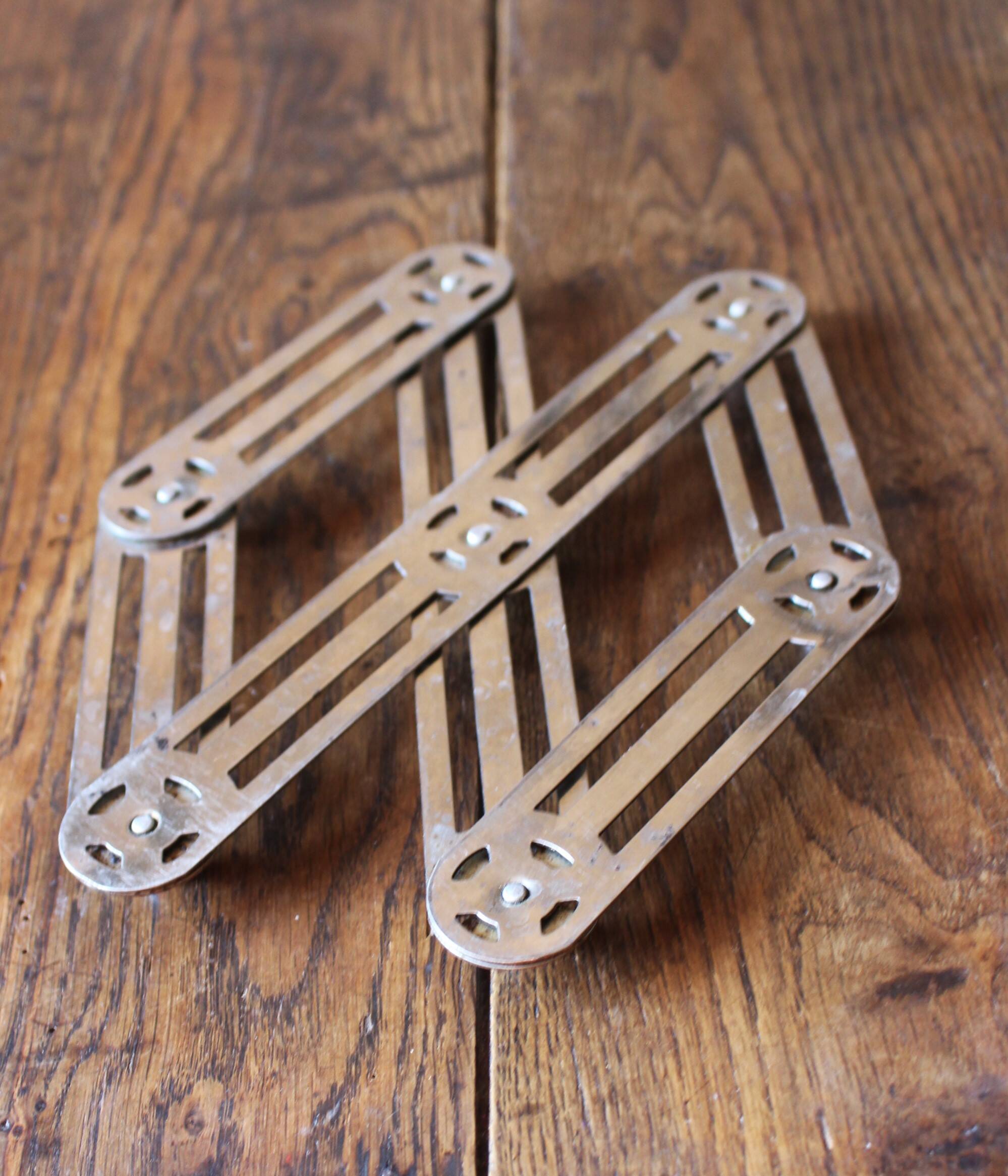 Vintage accordion folding metal trivet