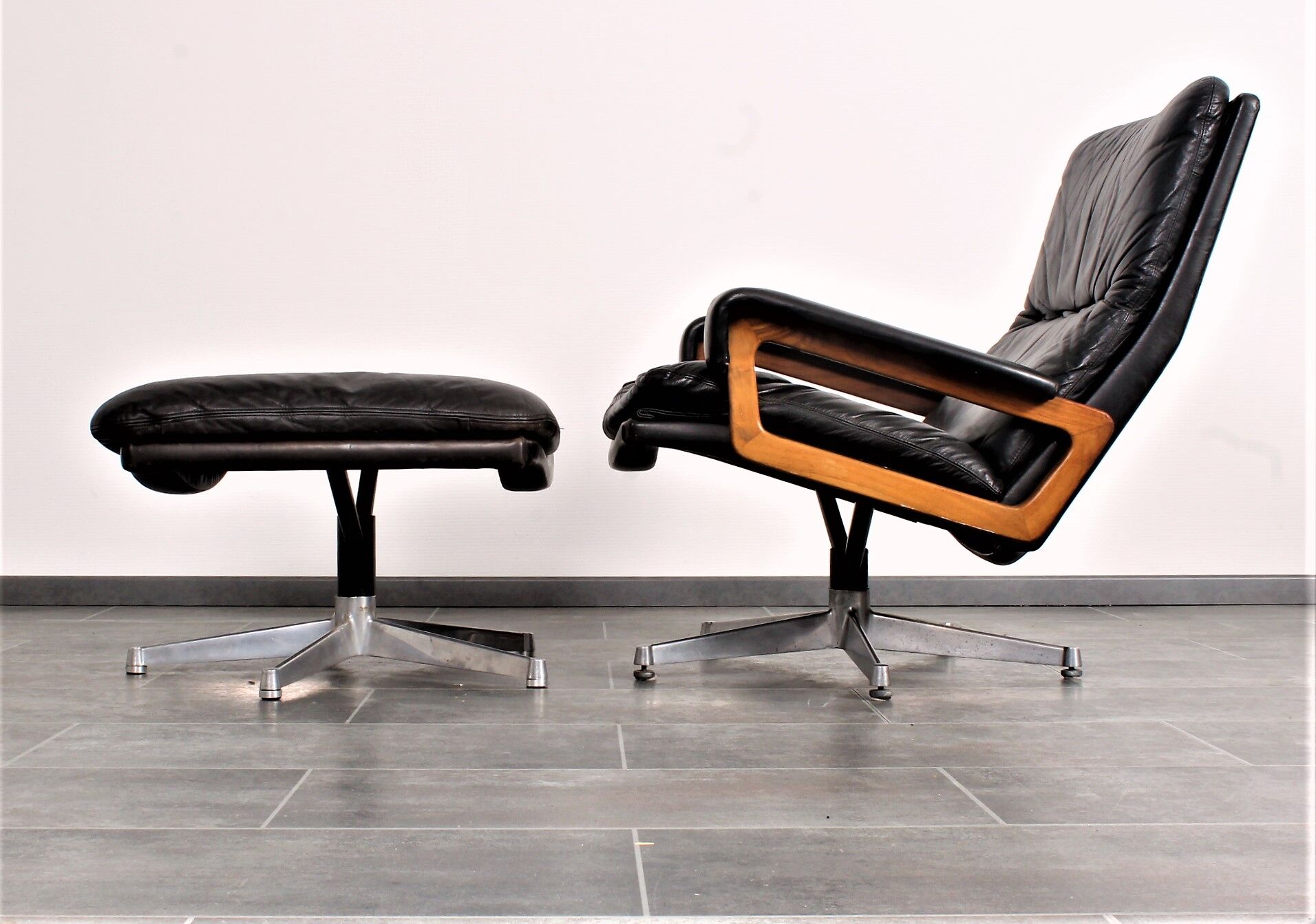Armchair and footstool by André Vandenbeuck for Strässle in black leather