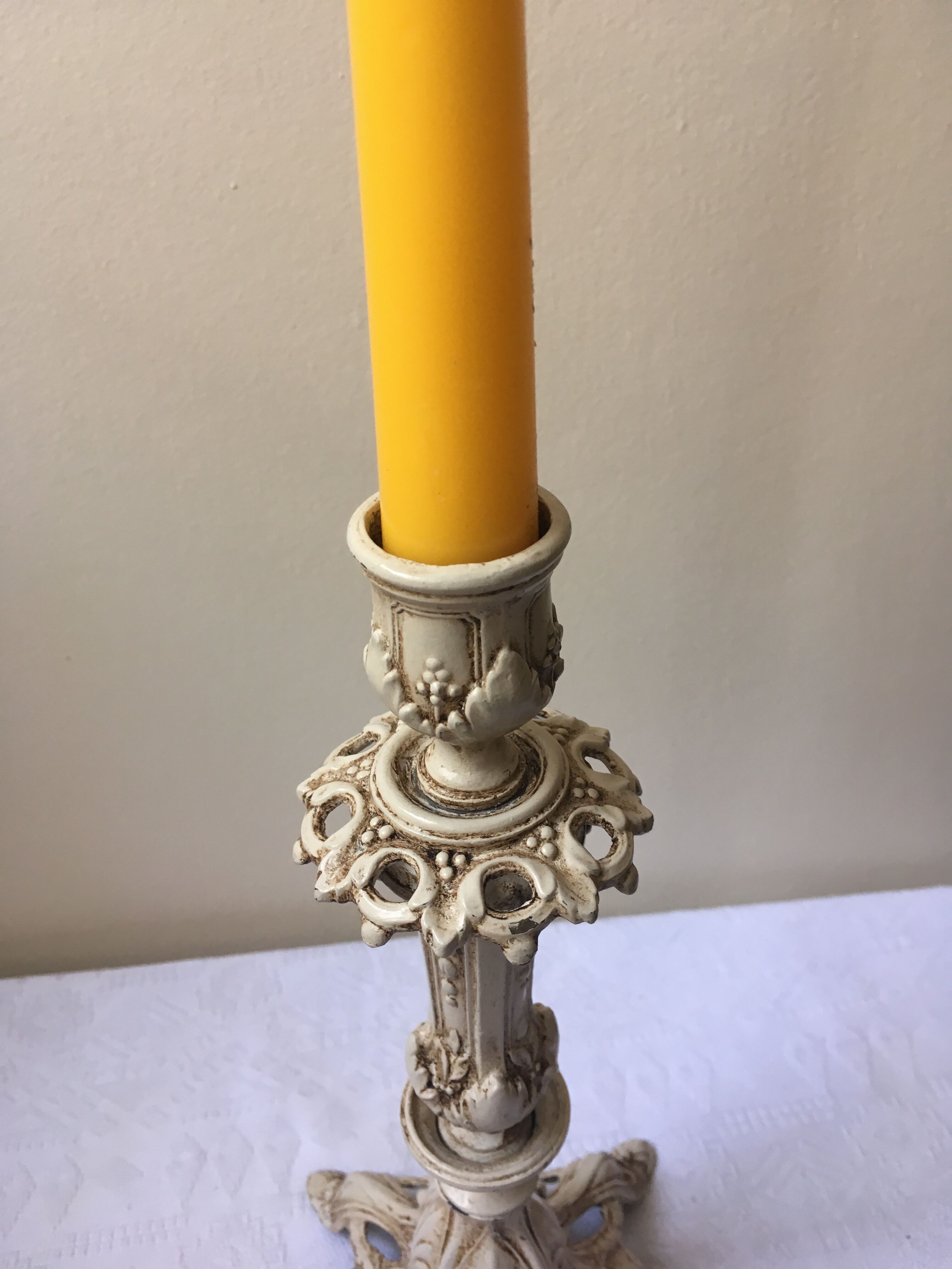 Large candle holder in patinated white painted metal