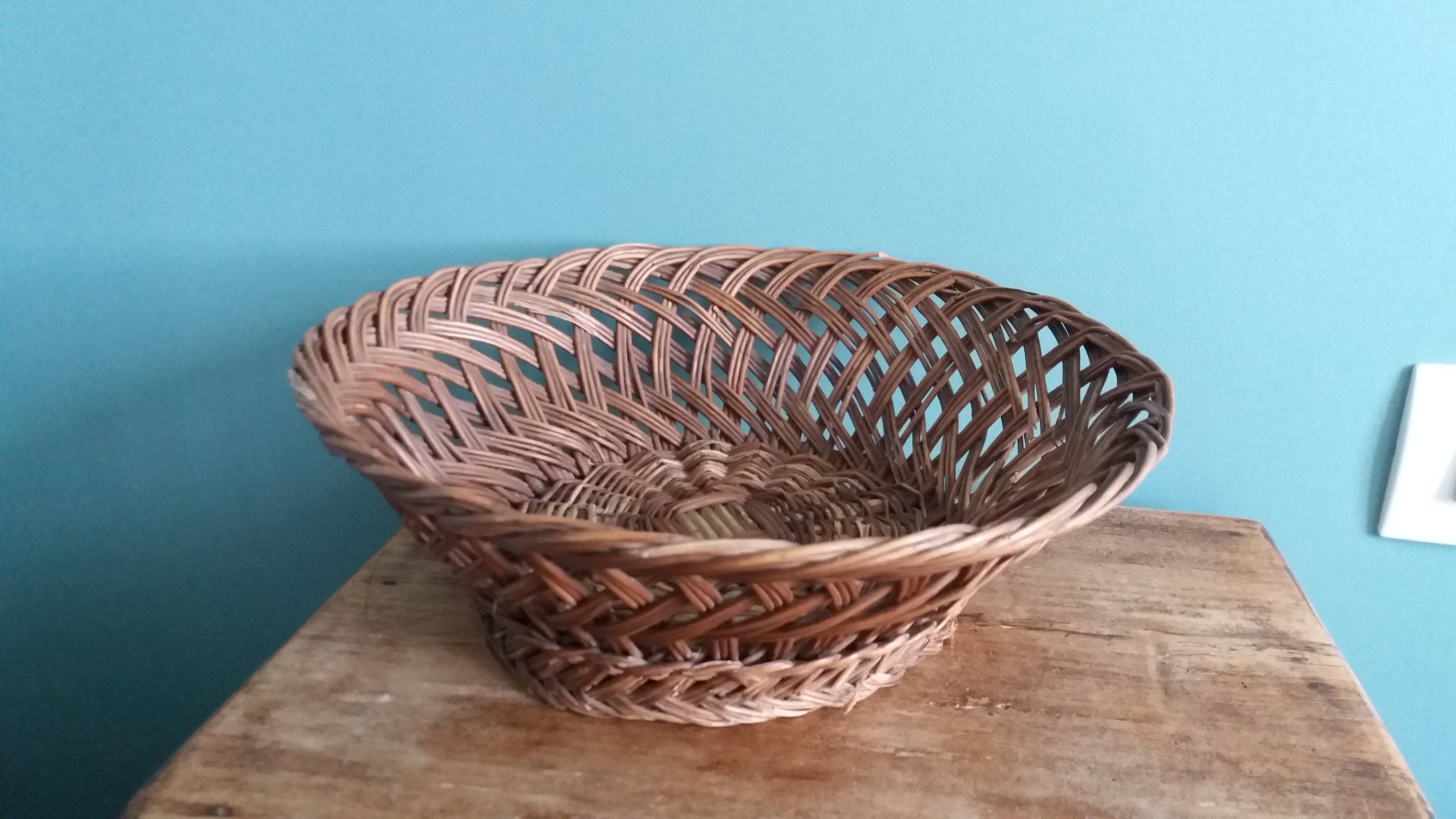Antique basket, fruit basket or bread basket made of wicker
