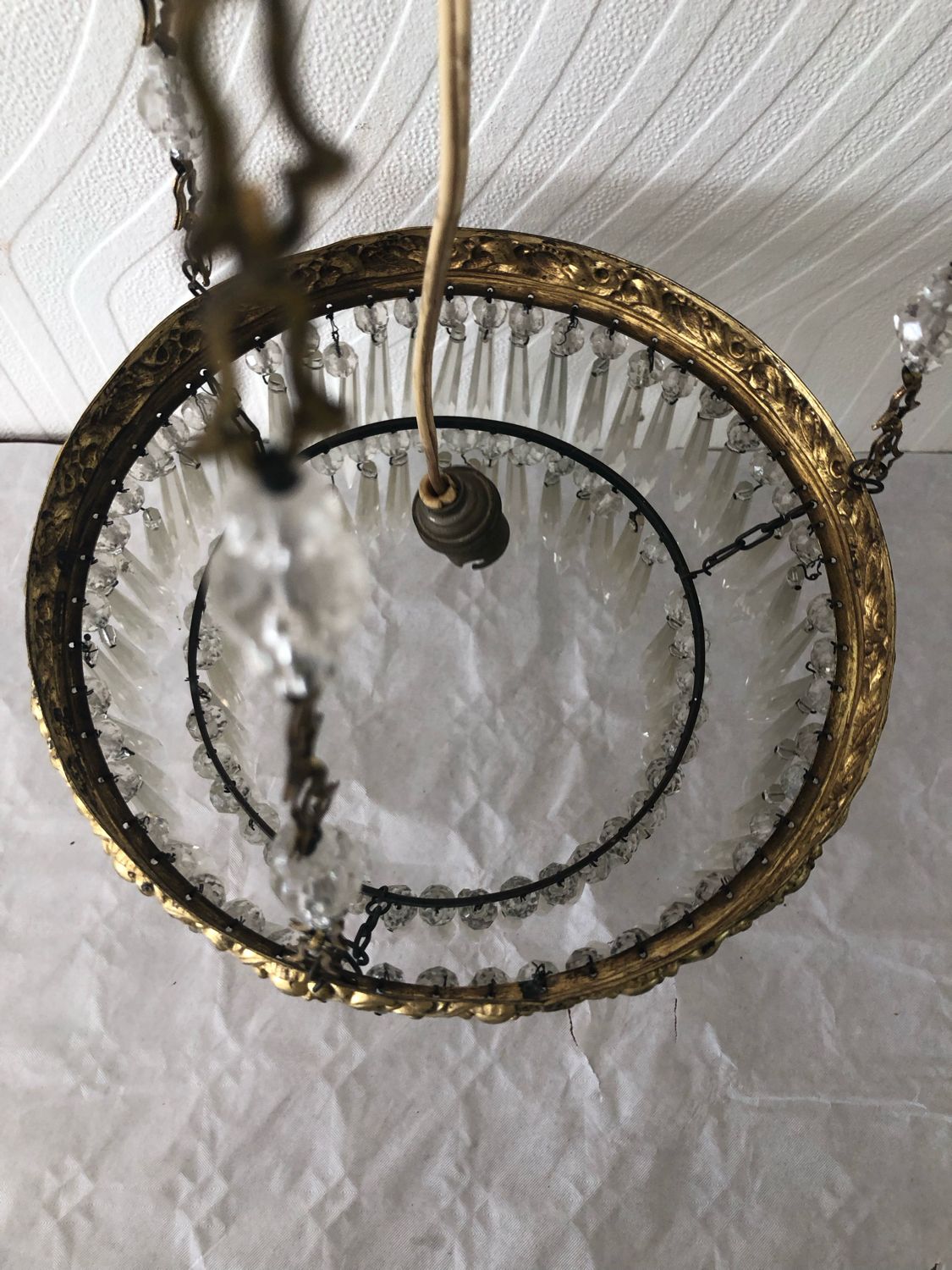 Vintage tassel chandelier has 2 glass and brass crowns