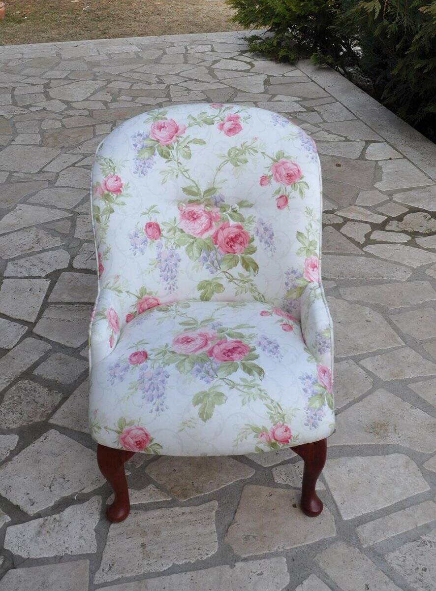 1950s vintage armchair in white and pink floral fabric, mahogany wooden legs.