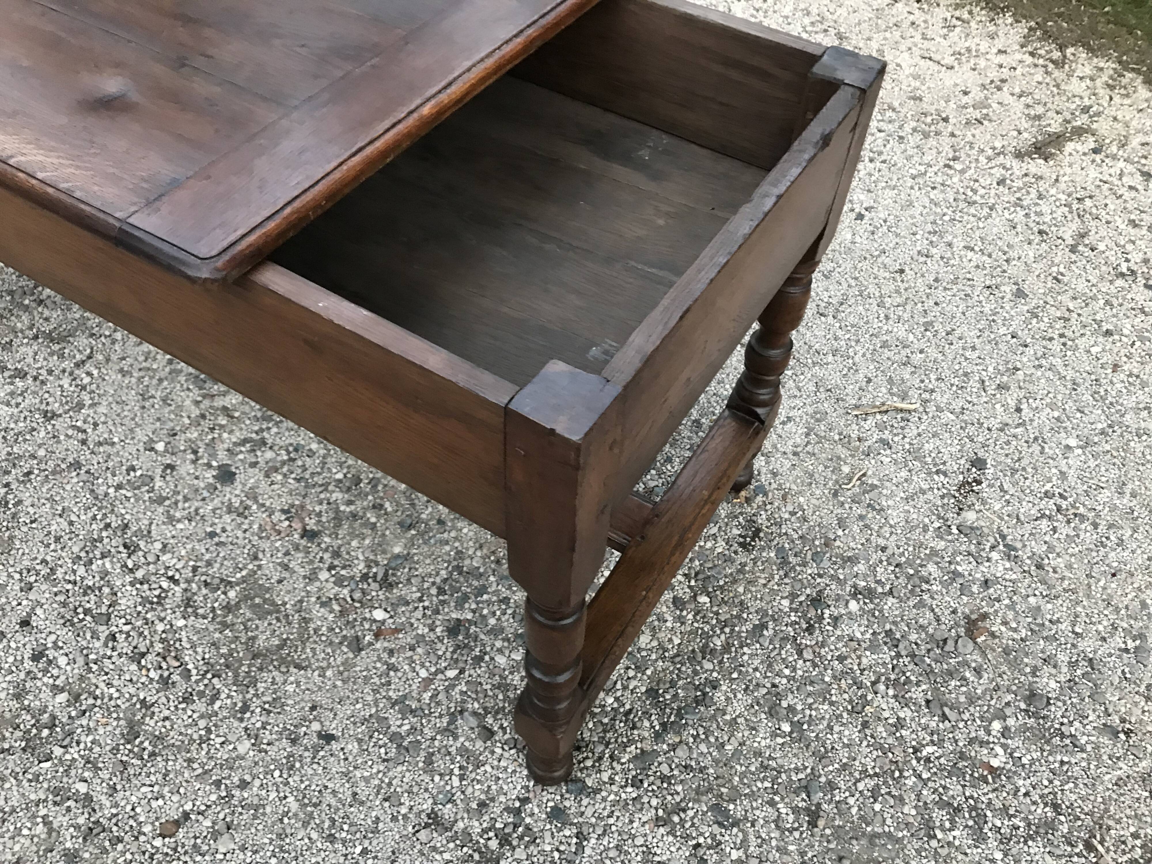 Croat farm table with a sliding tray