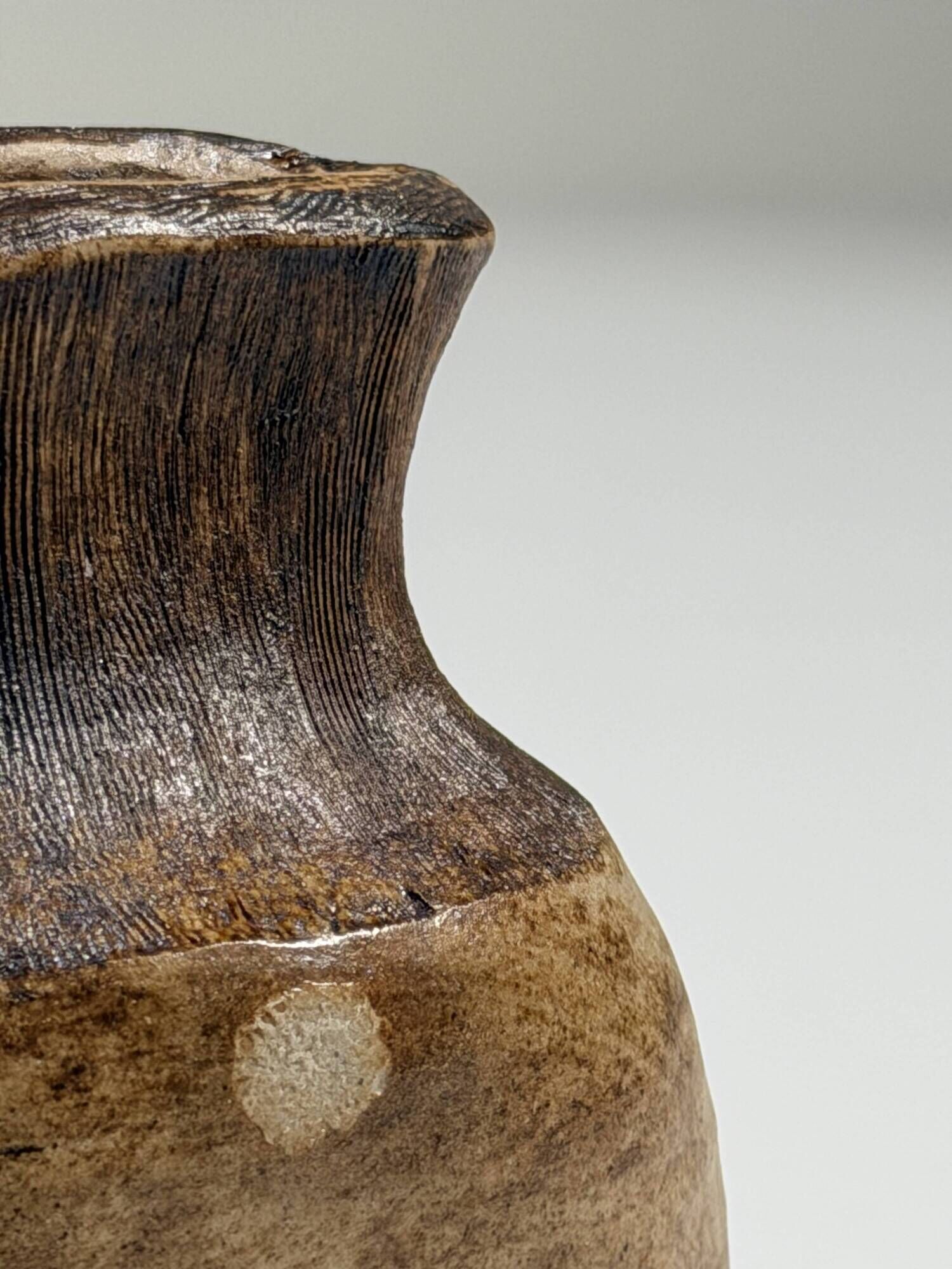 Small brutalist stoneware vase with a ribbed neck, France, circa 1960.