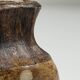 Small brutalist stoneware vase with a ribbed neck, France, circa 1960.