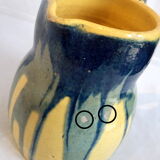 Yellow, blue and green rustic pitcher
