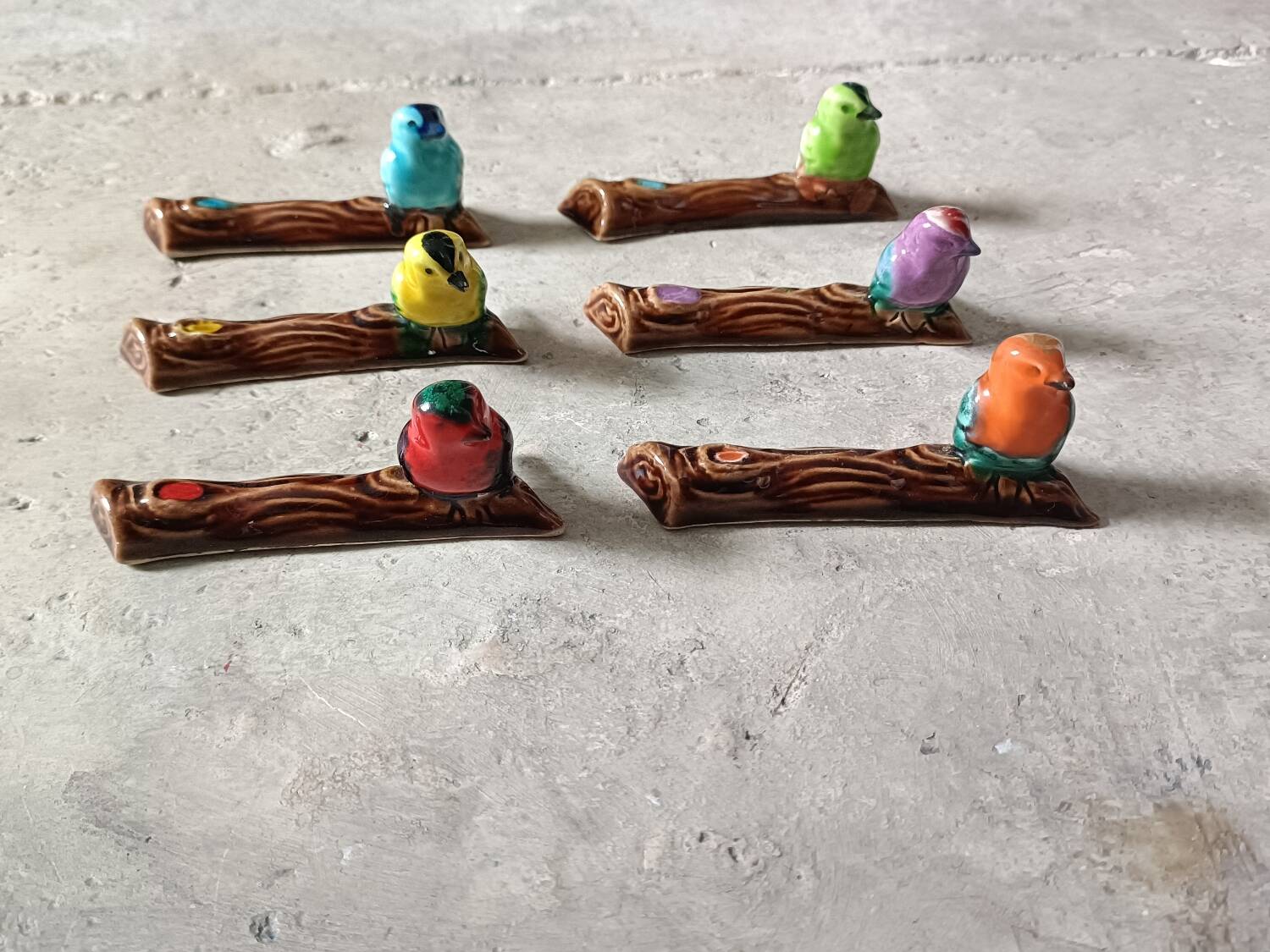 Set of six barbotine bird knife rests