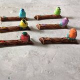 Set of six barbotine bird knife rests