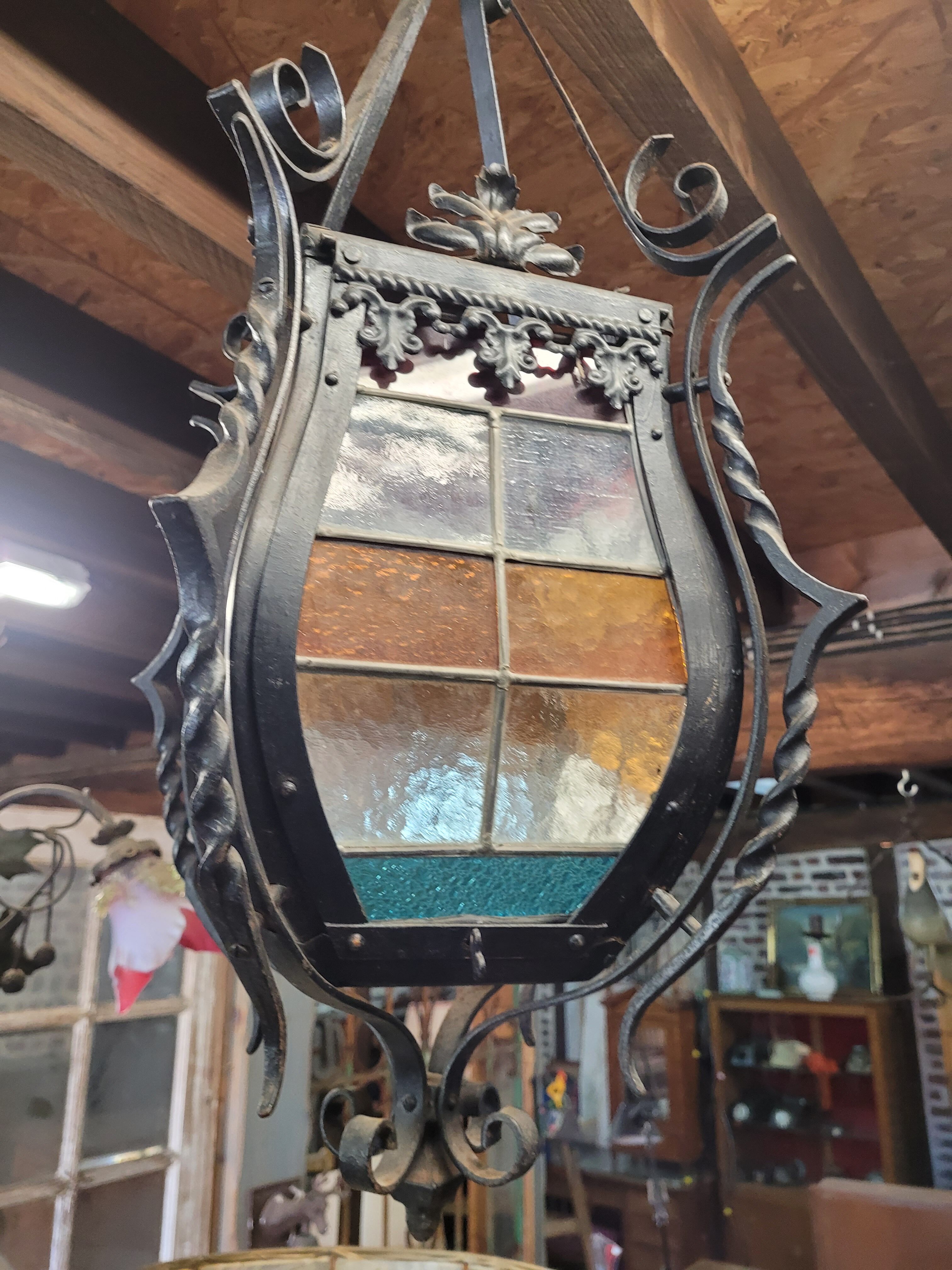 Wrought iron lantern with stained glass windows
