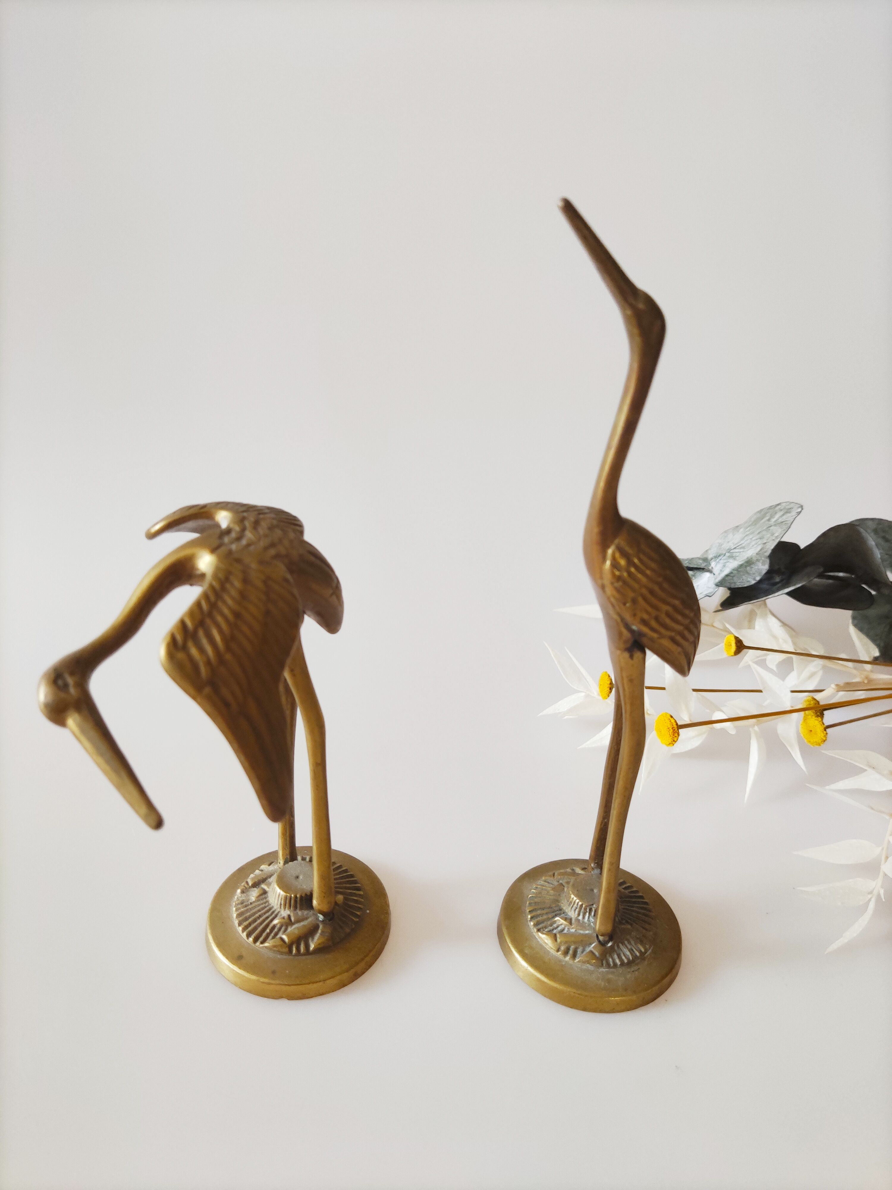 Brass heron duo