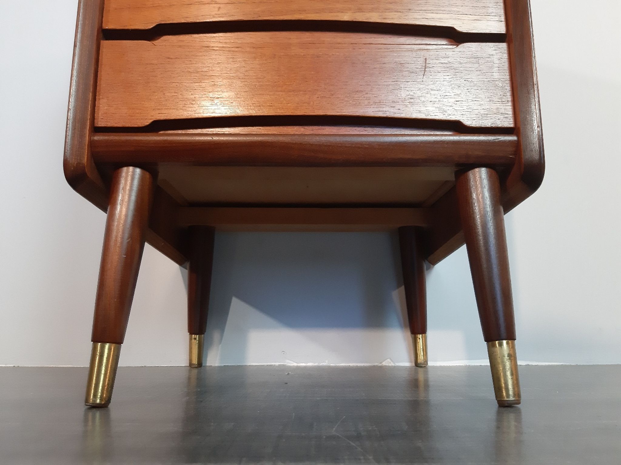 Norwegian bedside table with 3 drawers, teak and brass clogs