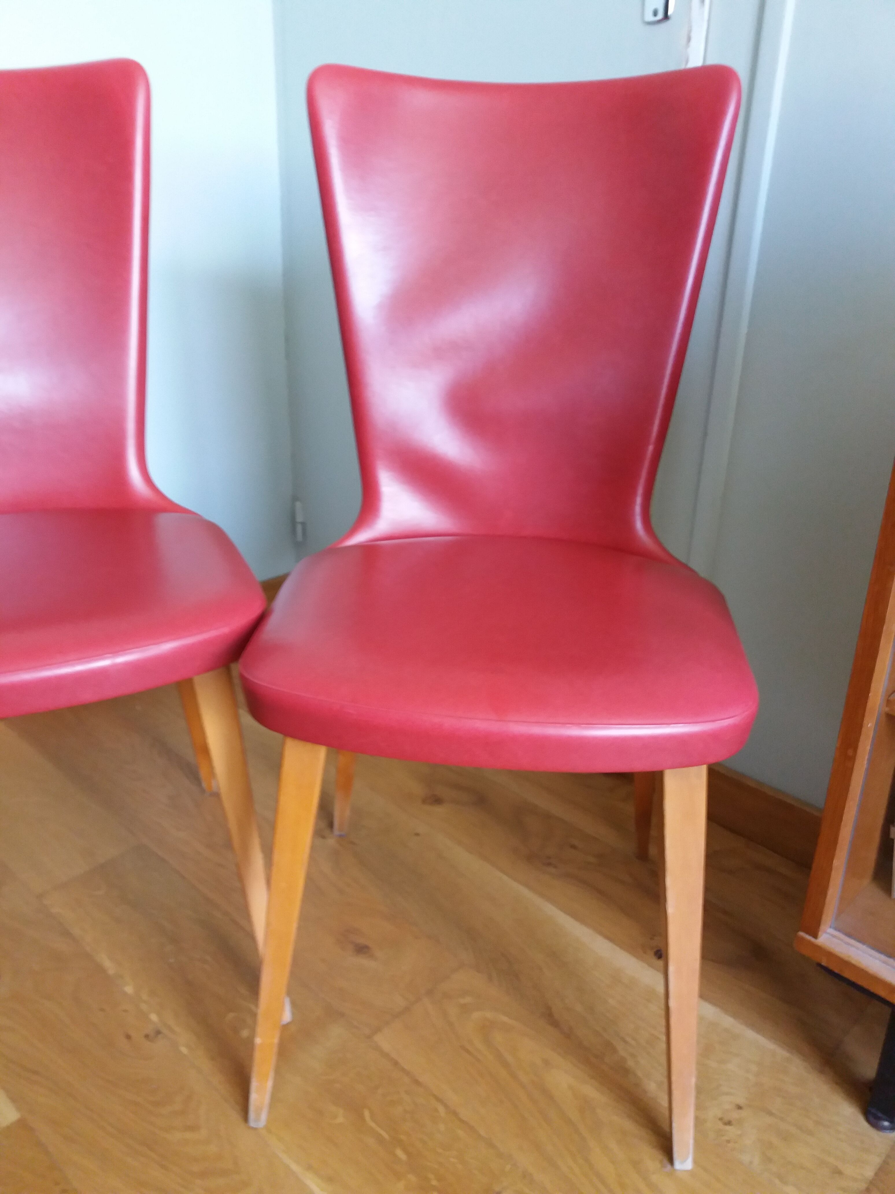Baumann skai red imitation leather chairs from the 1950s