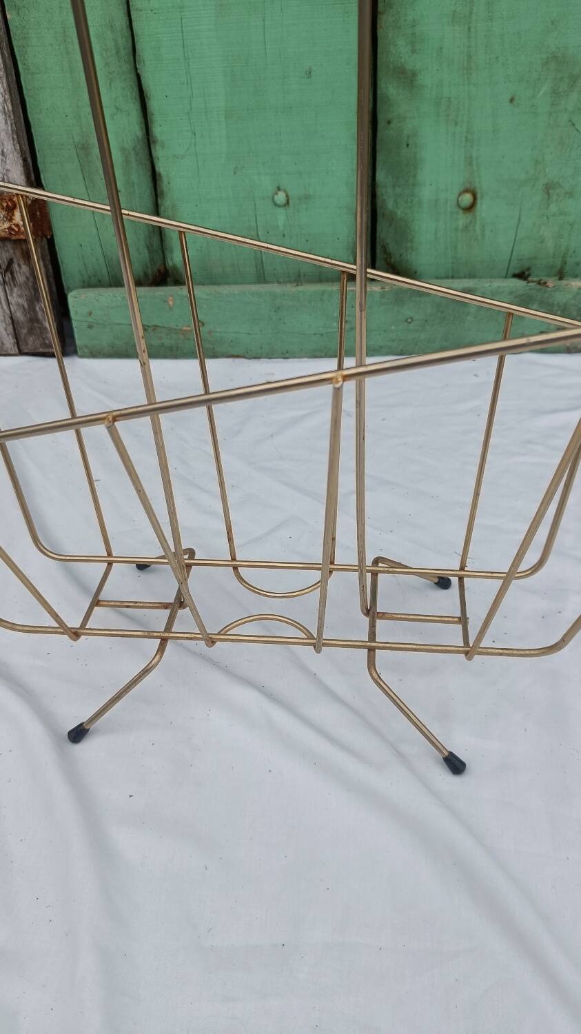 Vintage magazine rack in golden brass
