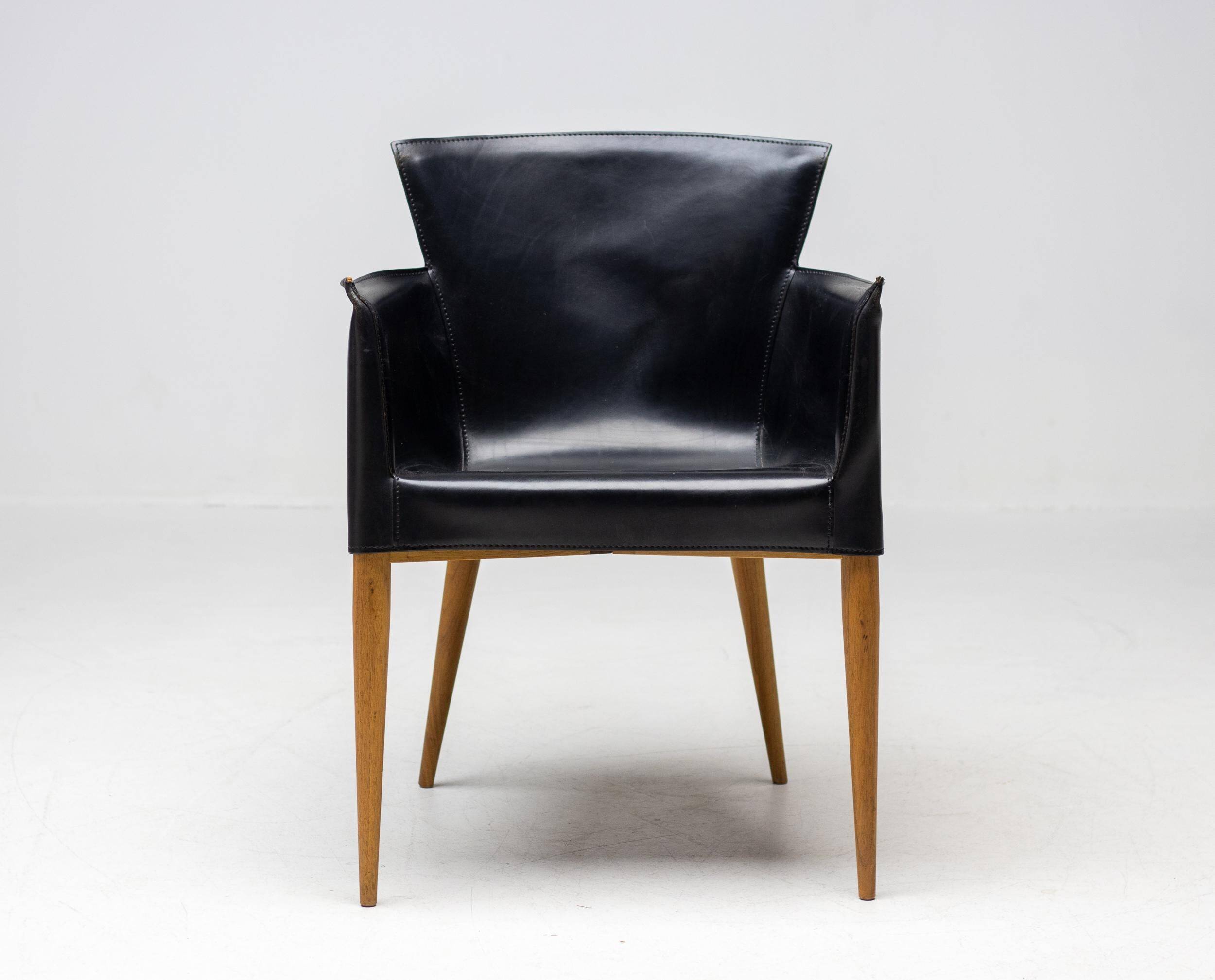 Set of four Vela leather armchairs by Carlo Bartoli - Italian modern elegance.