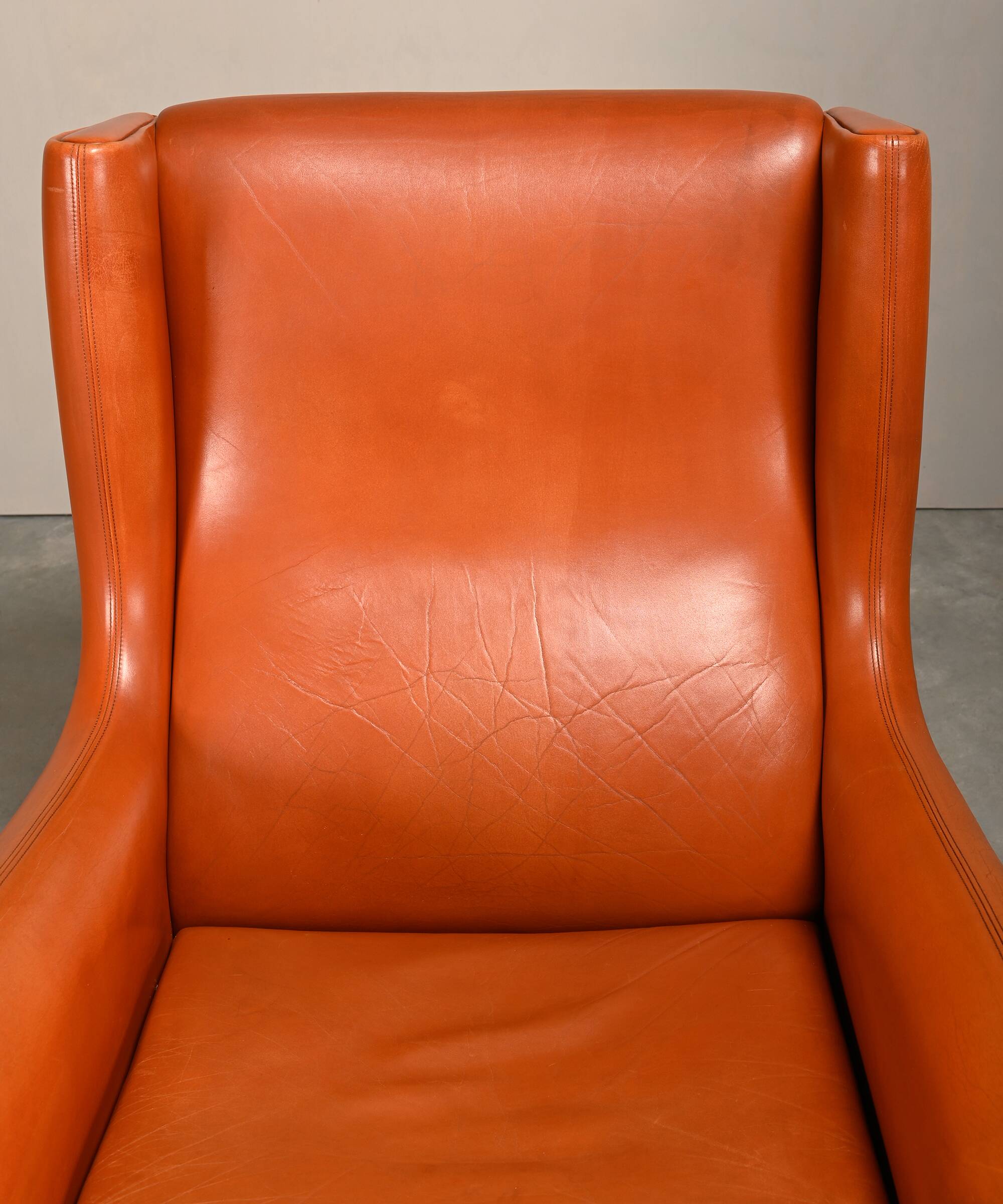 Illum Wikkelsø Wingback Armchair Model 110 in Cognac Leather, Denmark 1960s