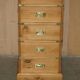 Restored vintage military high chest of drawers in English pine and brass.