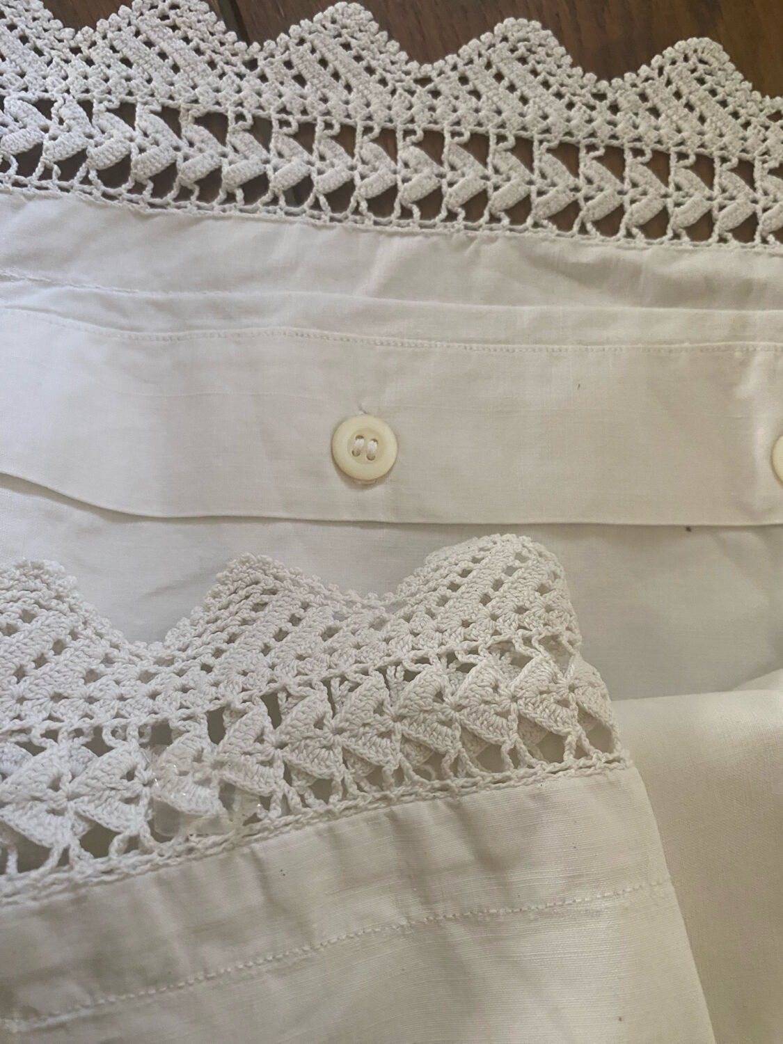 Antique white cotton pillowcase with crochet and monogram.