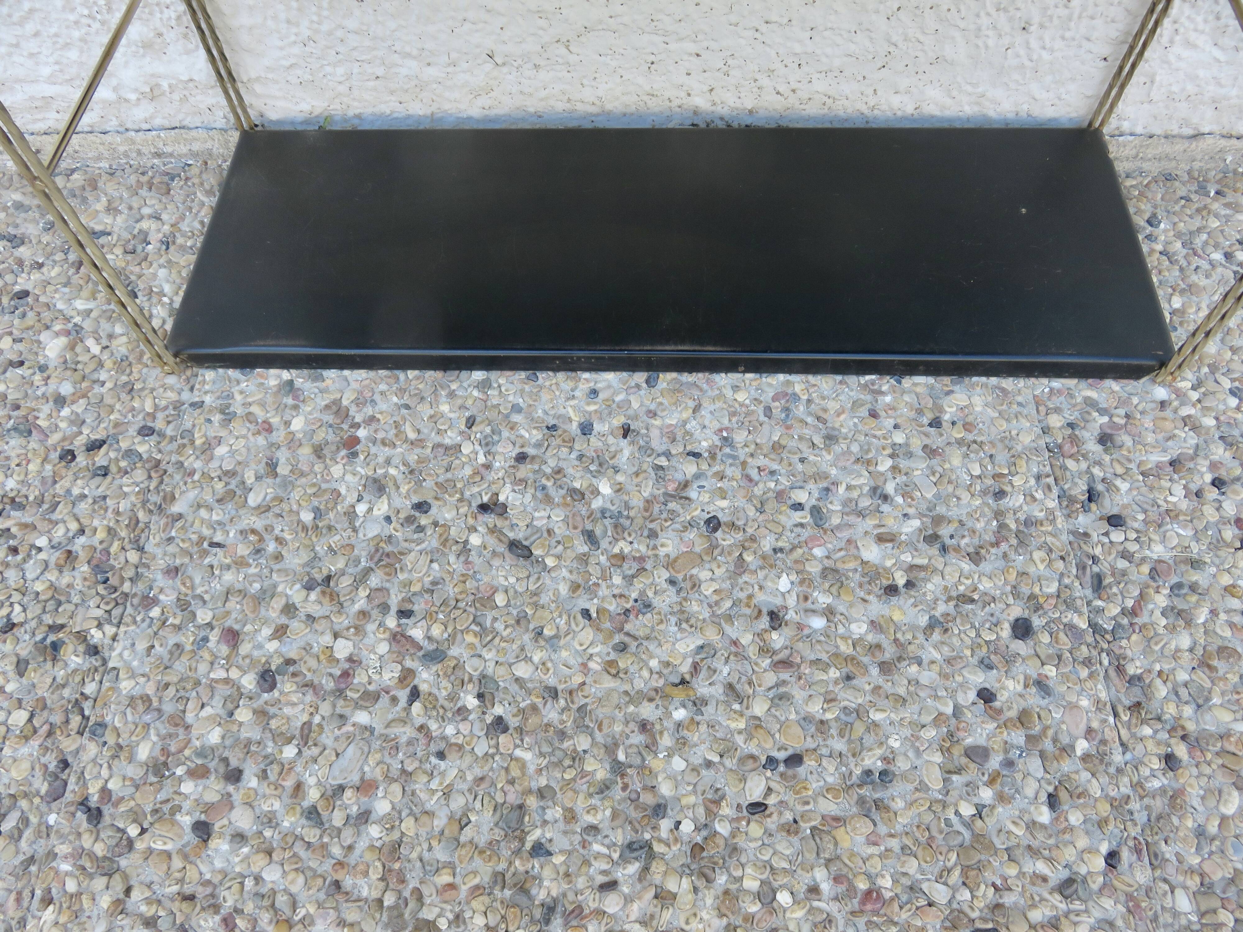 Modular String shelf in gold and black metal