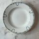 Set of 4 deep plates from Saint Amand with laurel wreath decoration.