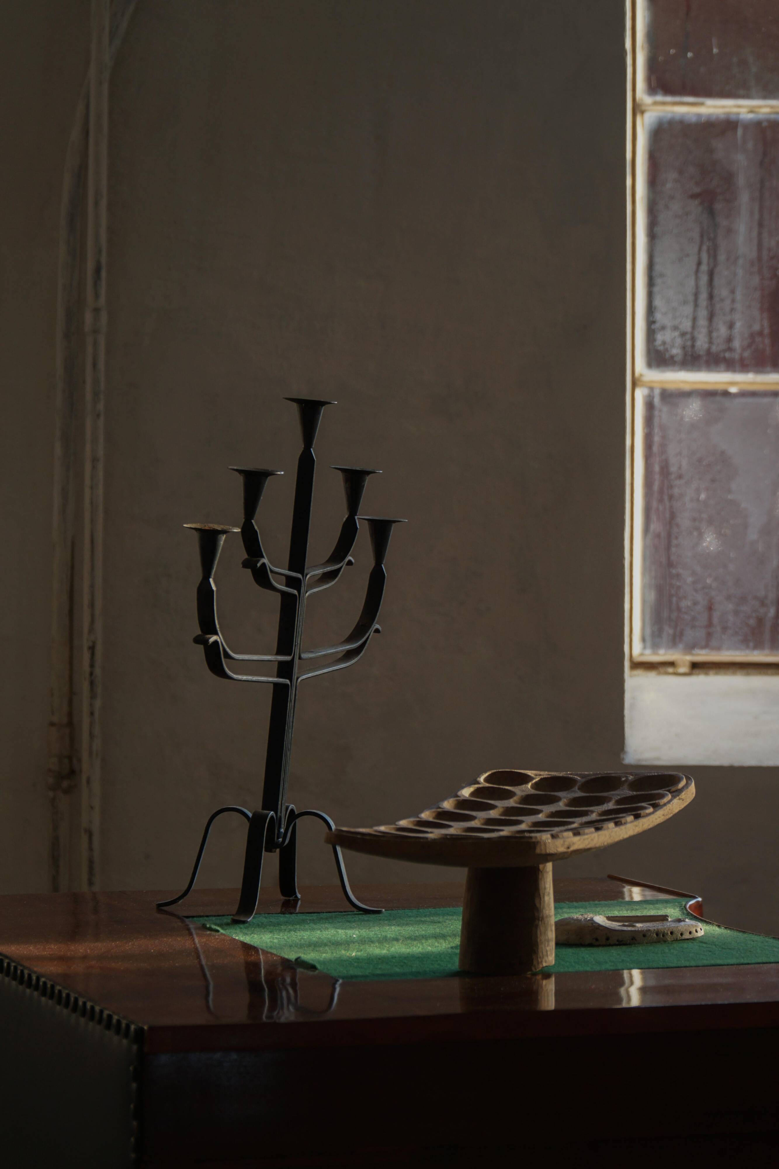 Brutalist Scandinavian candlestick in wrought iron and metal from the mid-20th century.