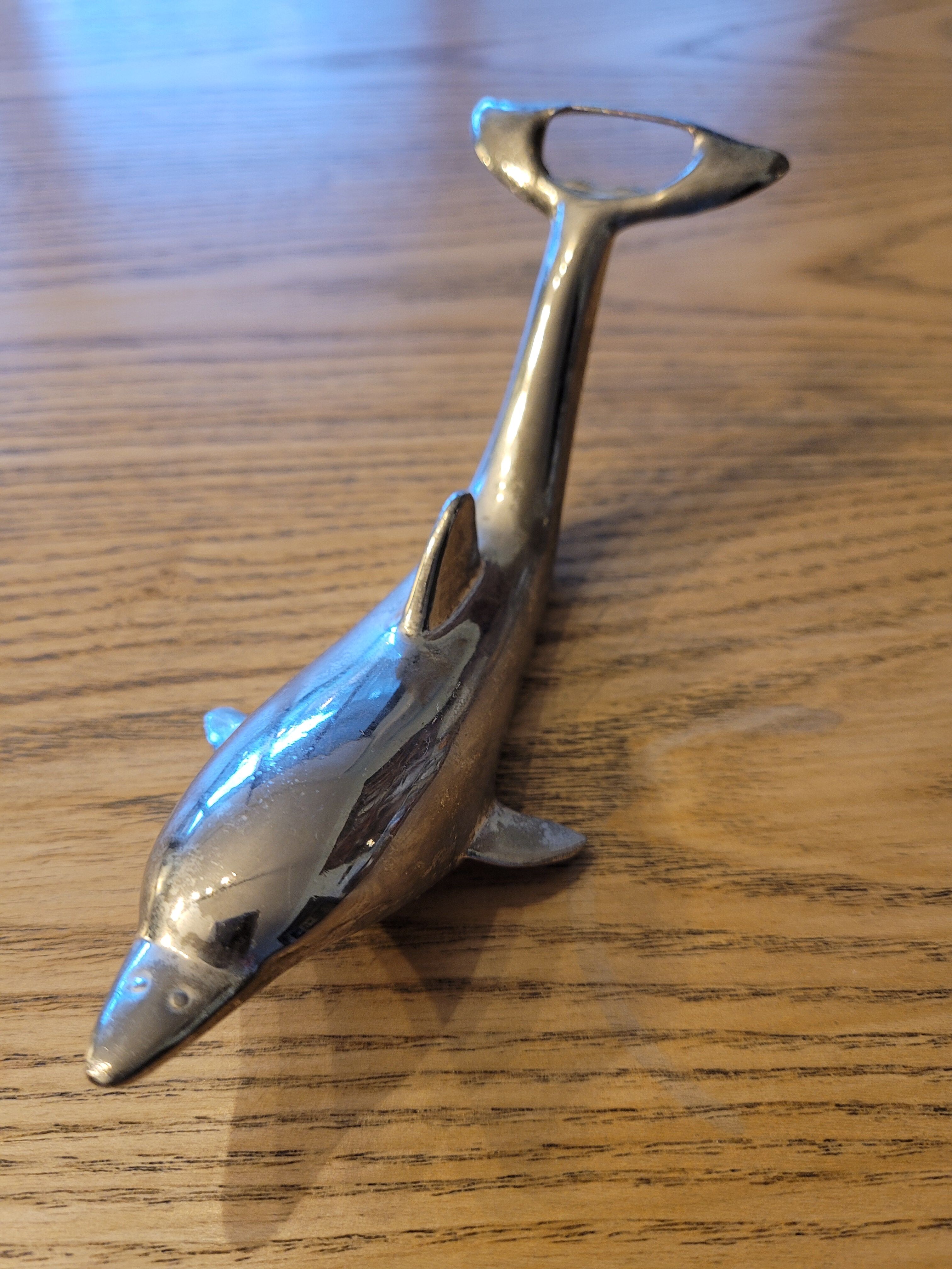 Silver dolphin bottle opener