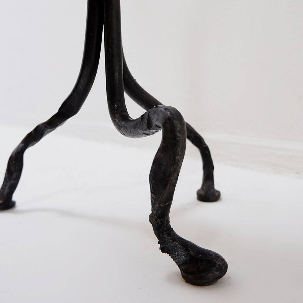 Large wrought iron candelabrum with an abstract design and three candle holders.