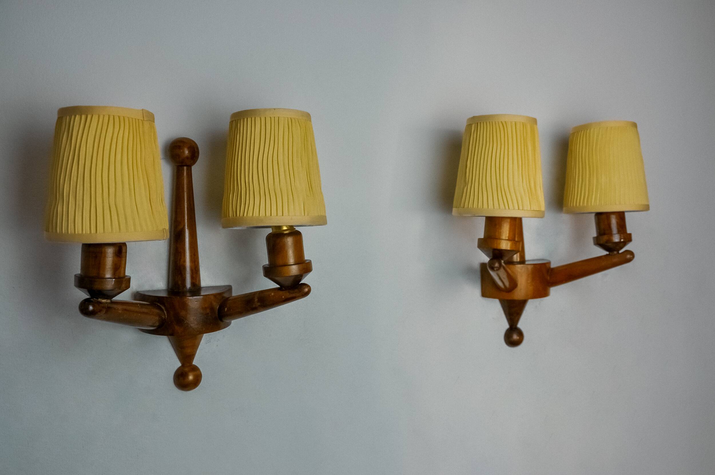 Pair of two-armed art deco wall lights, carved wood, France, 1960