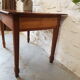 Walnut table with drawer