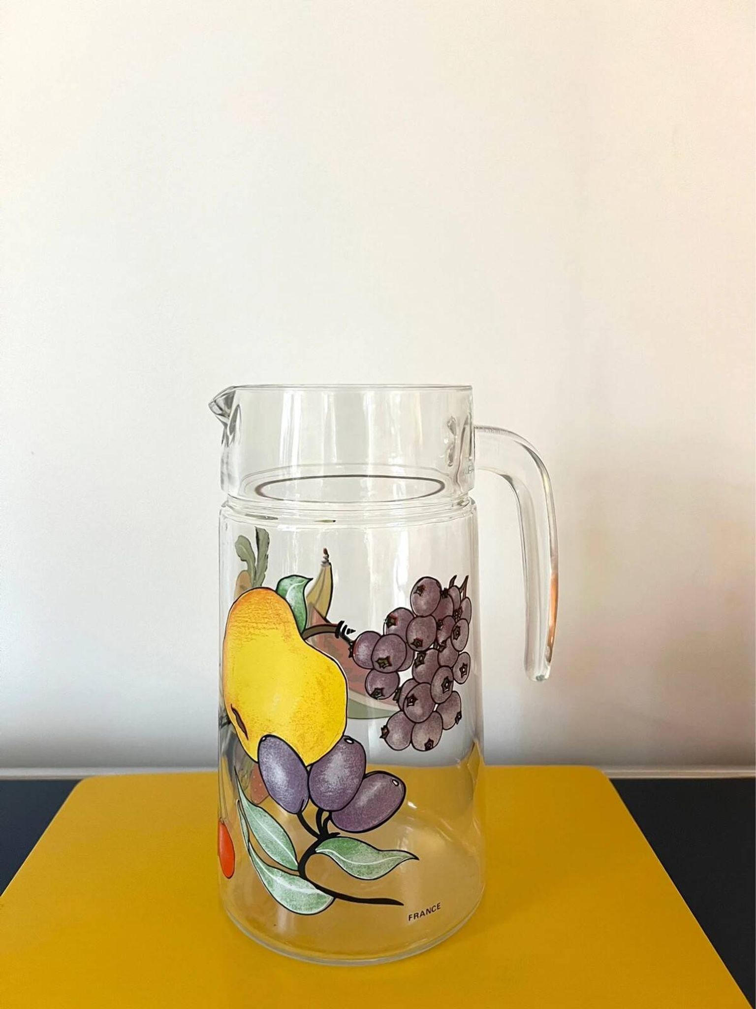 Vintage glass carafe with painted fruits