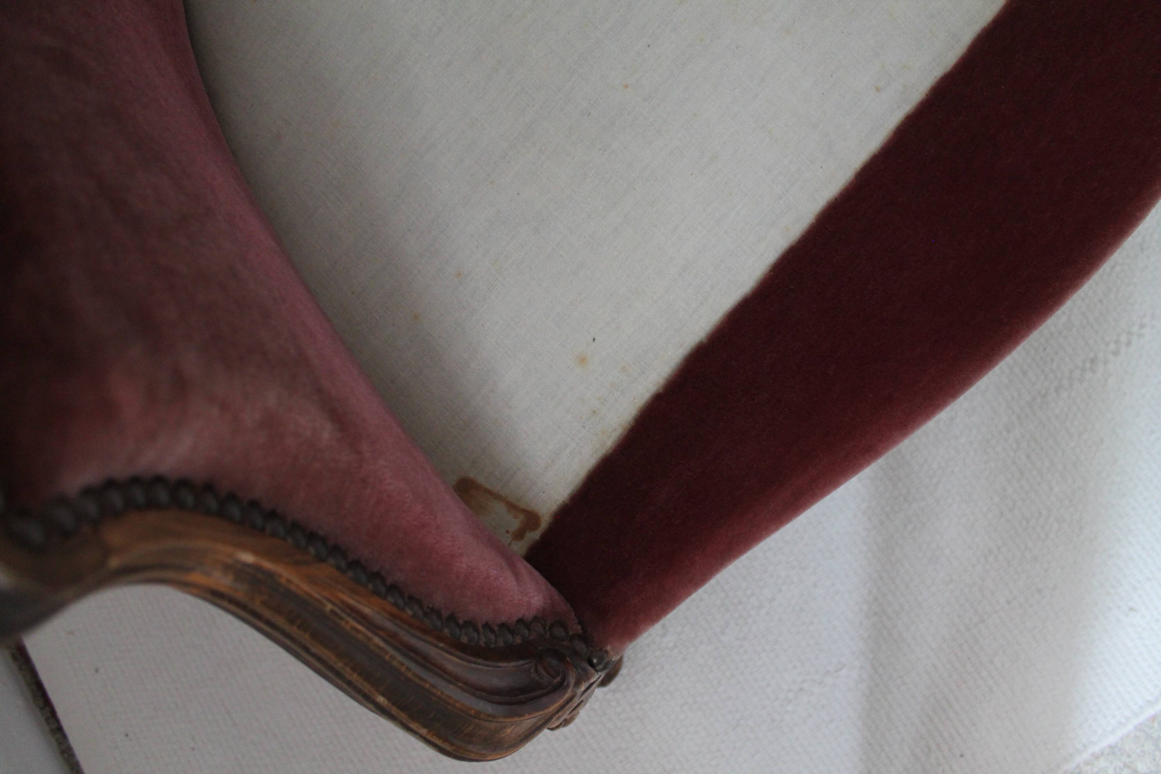 Faded pink velvet sofa