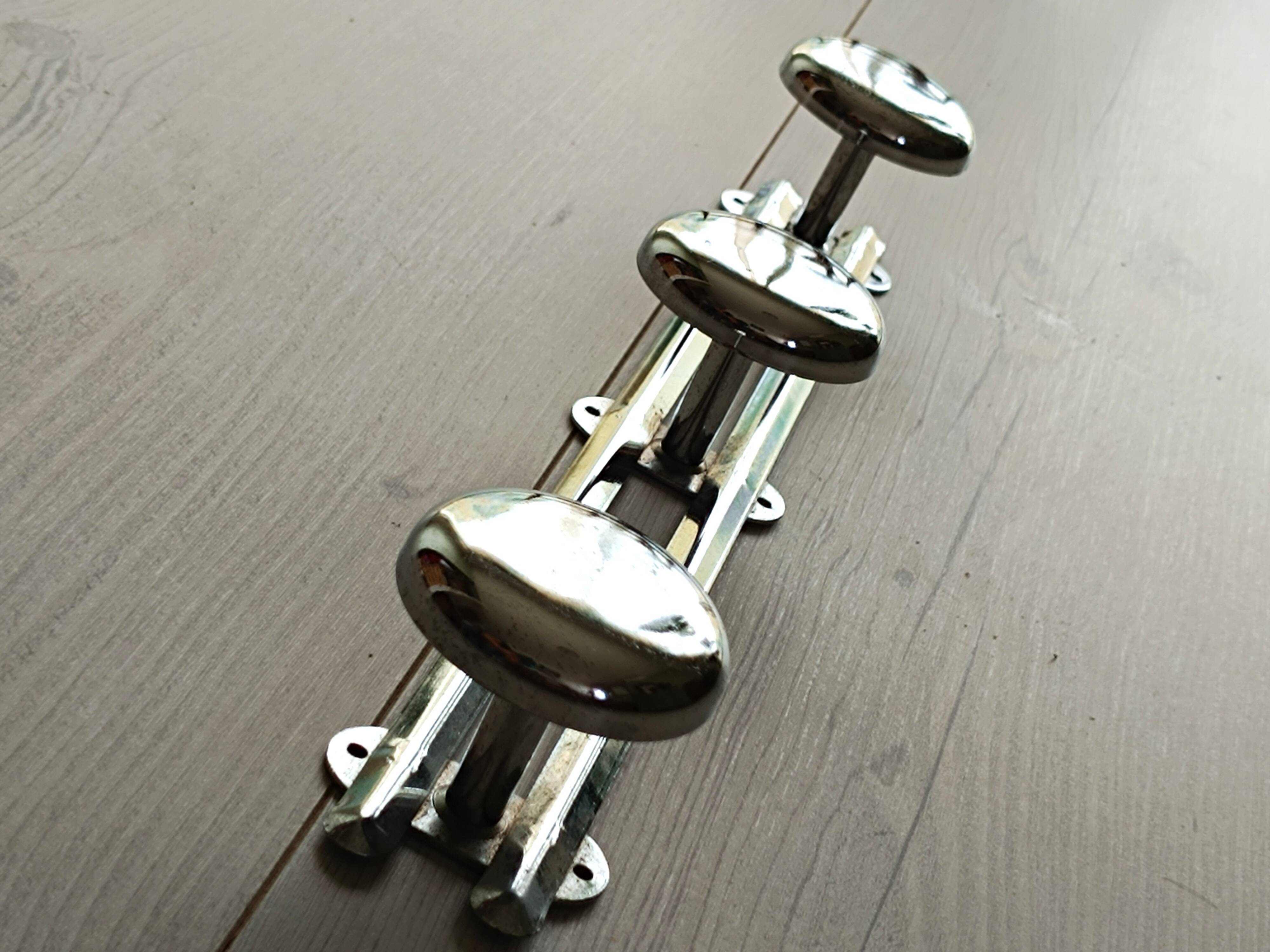 Chrome metal wall coat rack